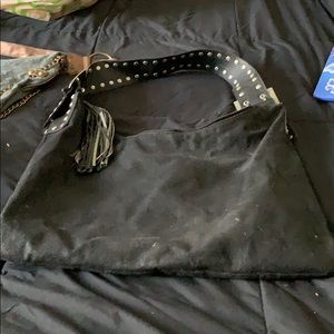 Black hobo faux suede material with studded strap